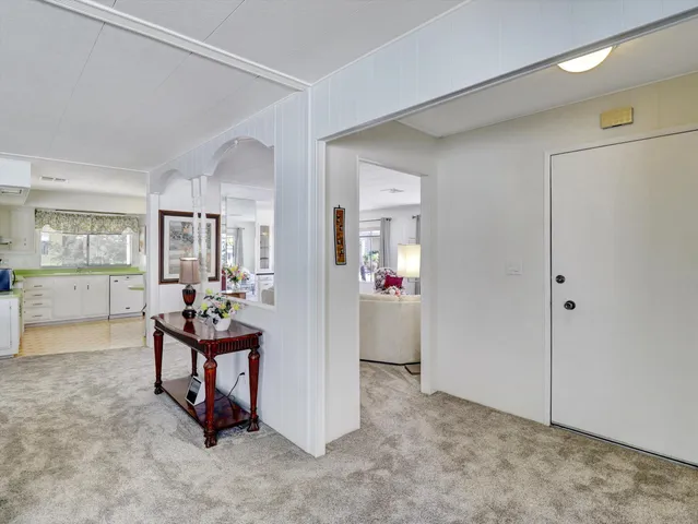 a view of room with furniture and wooden floor