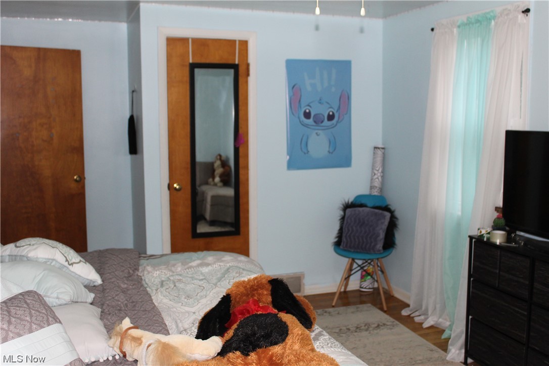 1292 Ford Road Lyndhurst, OH 44124 - Photo 18 of 25 Bedroom with light wood flooring