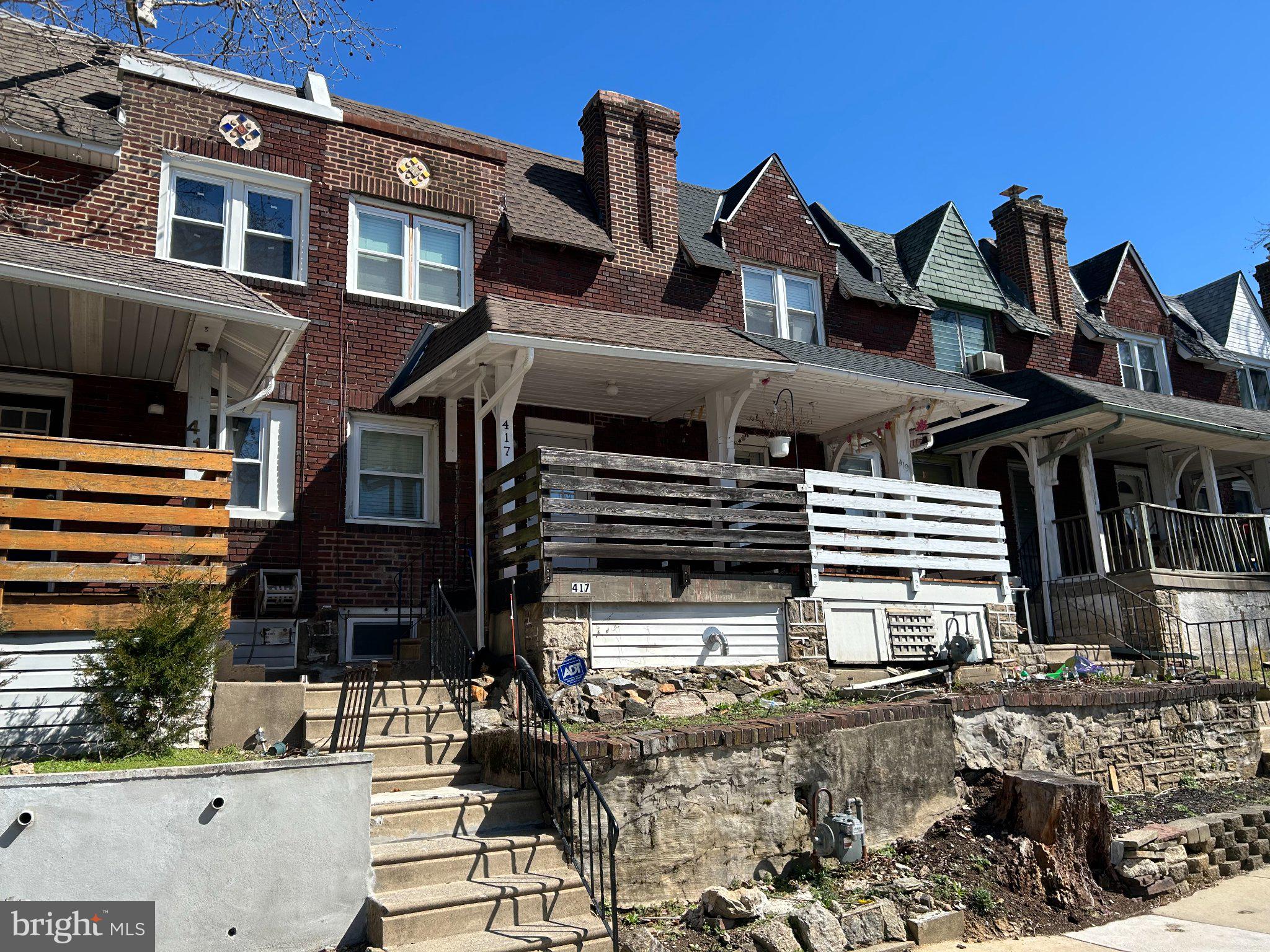 a front view of a house with parking space