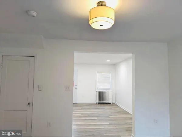 a view of a room with a sink and a refrigerator