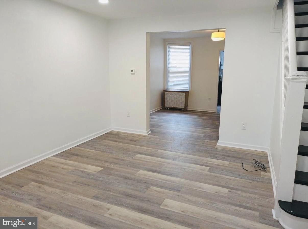 417 Copley Road Upper Darby, PA 19082 - Photo 6 of 14 a view of hallway with wooden floor