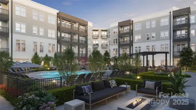 a view of a patio with couches table and chairs potted plants and palm tree