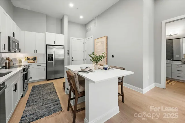 a kitchen with a sink a refrigerator and a stove