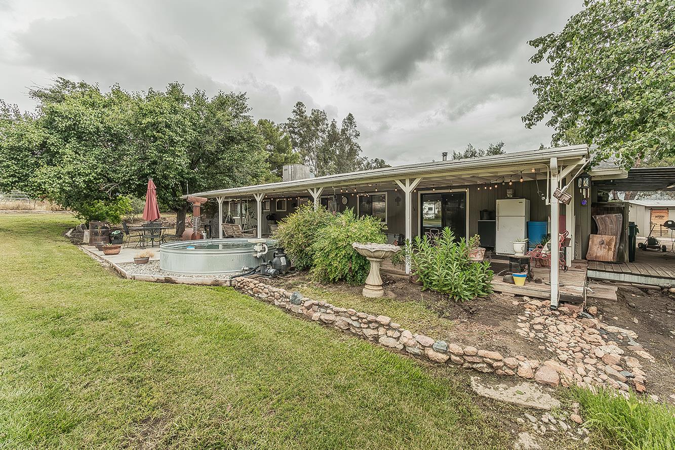 29545 Oak Meadow Road Tollhouse, CA 93667 - Photo 6 of 69 a view of a house with backyard sitting area and garden