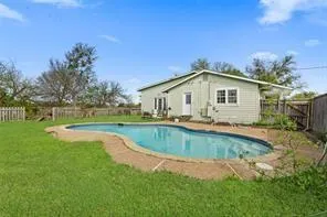 a front view of house with yard and outdoor seating