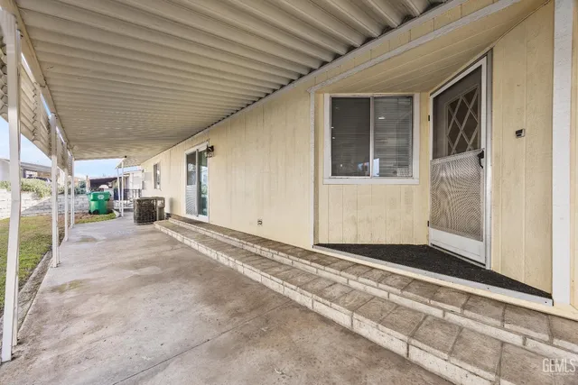 a view of a kitchen with a sink and cabinets
