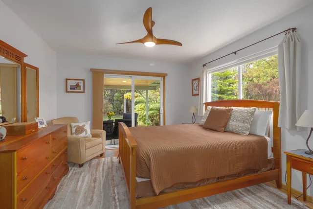 a bedroom with a large bed and a large window