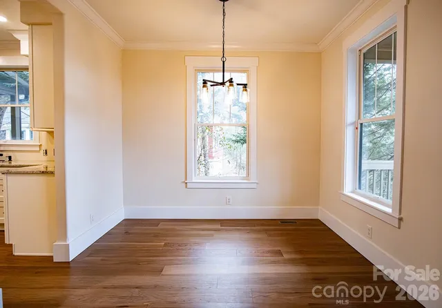 a kitchen with stainless steel appliances a sink stove and cabinets