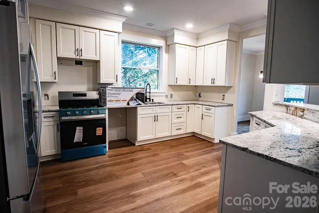 a room that has a bed and a window in it