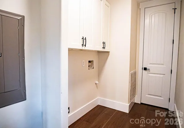 a view of hallway with wooden floor