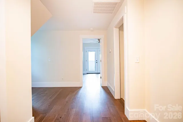 a bathroom with a granite countertop toilet a sink and a bathtub