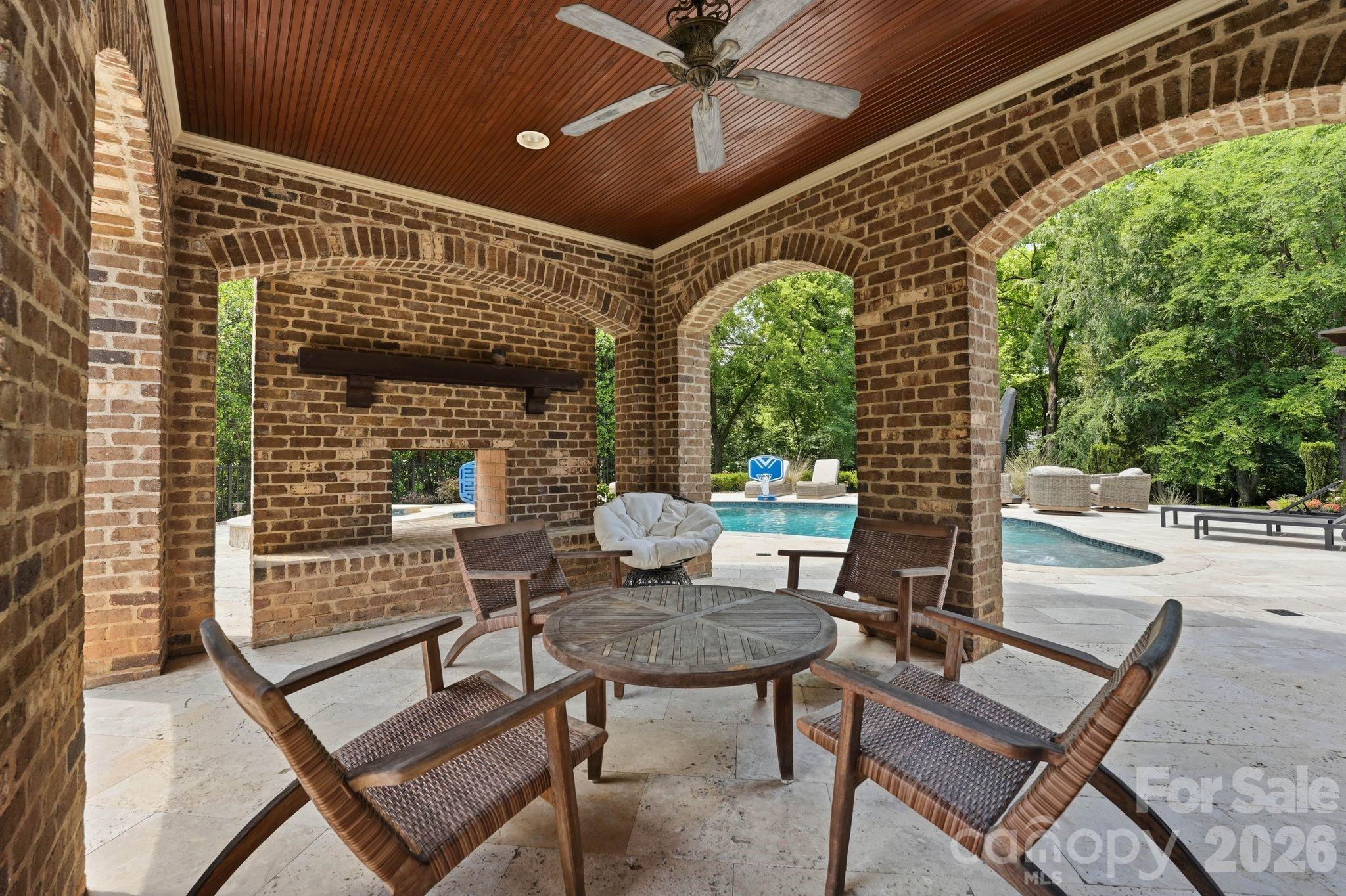 7416 Lee Rea Road Charlotte, NC 28226 - Photo 11 of 48 a patio with table and chairs and potted plants