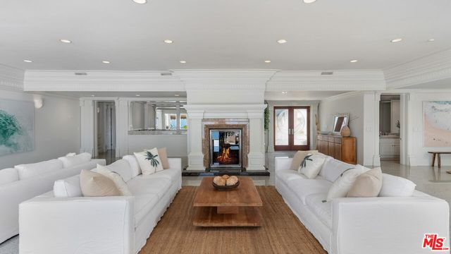 a bathroom with a granite countertop sink and a large mirror