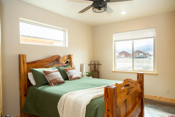 a bedroom with a bed and a window