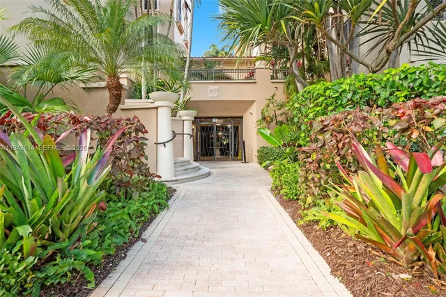 a entryway with flower plants