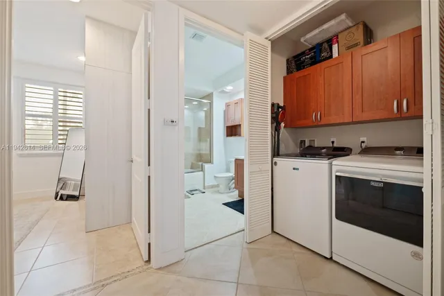 a kitchen with a refrigerator and a stove