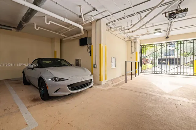 a car parked in front of a garage