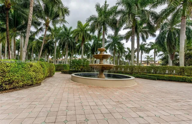 a view of swimming pool with outdoor seating and lake