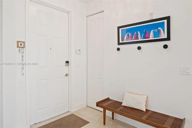 a view of a hallway with paintings on the wall