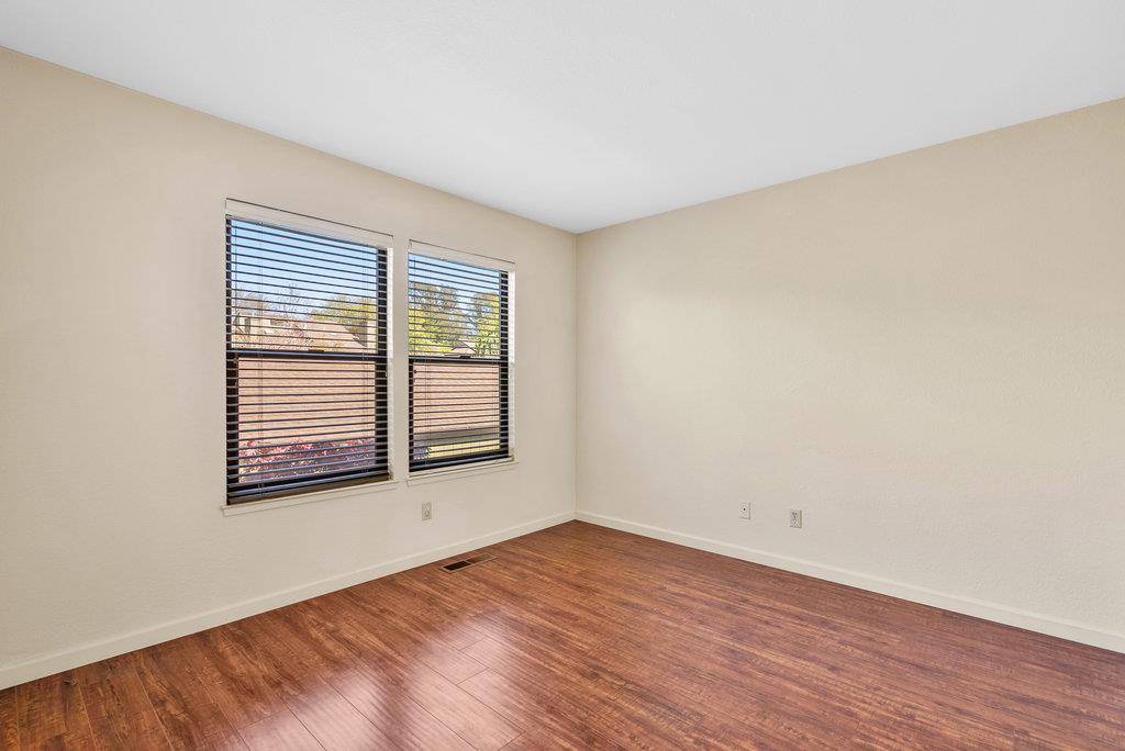 2747 Subec Lane Soquel, CA 95073 - Photo 16 of 34 an empty room with wooden floor and windows