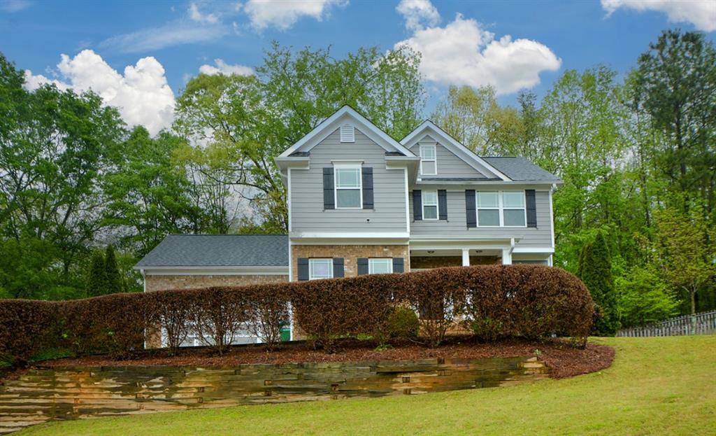 341 Allen Bridge Road Talmo, GA 30575 - Photo 1 of 1 a front view of a house with a yard and a large tree in the background