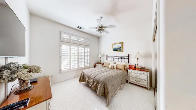 a bedroom with a bed furniture and a window