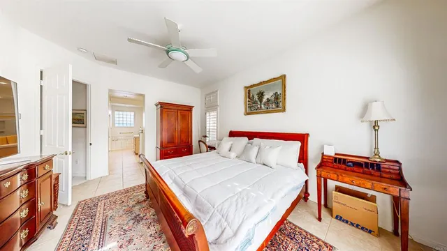 a bedroom with a bed and a book shelf