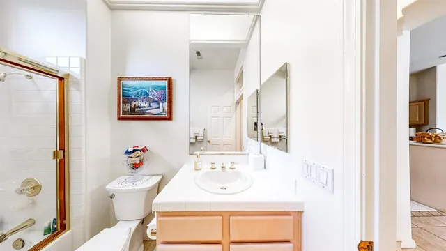 a view of a backyard with plants and a patio