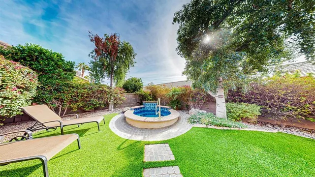a view of an house with backyard porch and patio