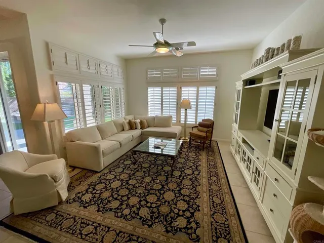 a view of a backyard with sitting area