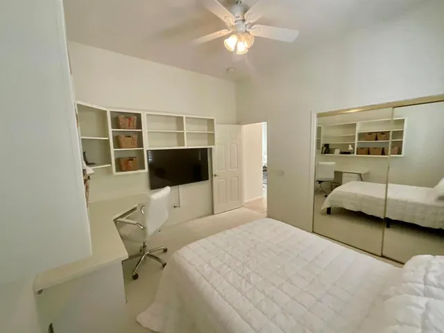 a bedroom with a bed furniture and a window