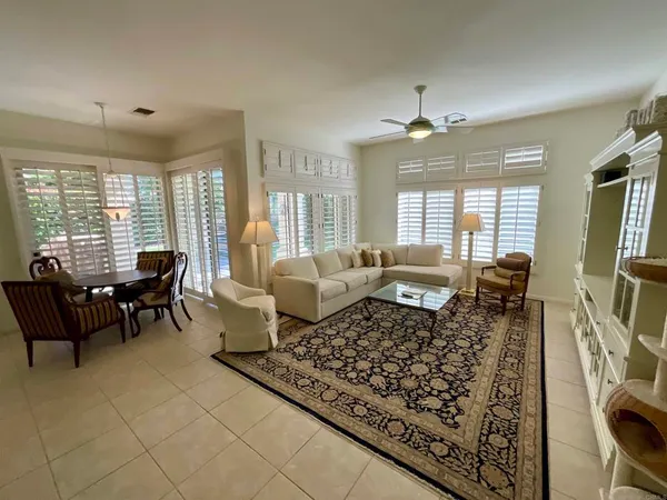 a bathroom with a tub a sink a mirror and a shower