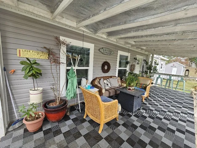 a outdoor living space with furniture and a potted plant