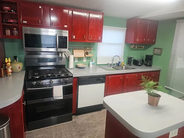 a living room with furniture and a mirror