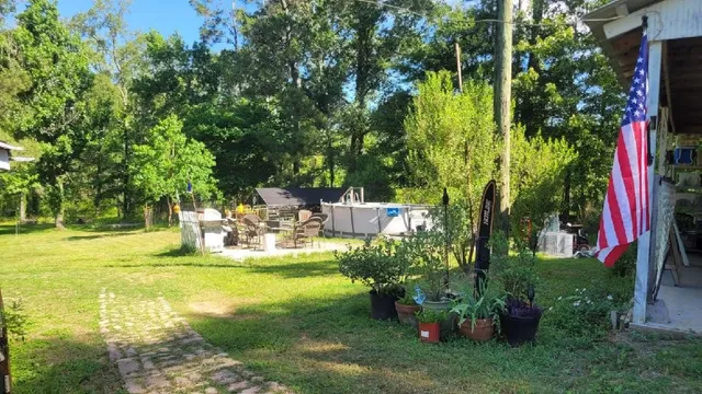 a view of swimming pool with a yard