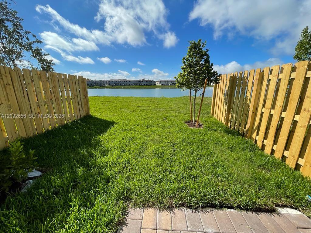 10144 Southwest 228th Terrace Miami, FL 33190 - Photo 22 of 23 a view of a garden with an outdoor space