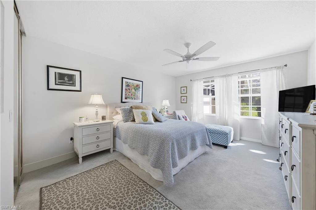 3614 El Segundo Court Naples, FL 34109 - Photo 17 of 49 a room with bed mirror and window