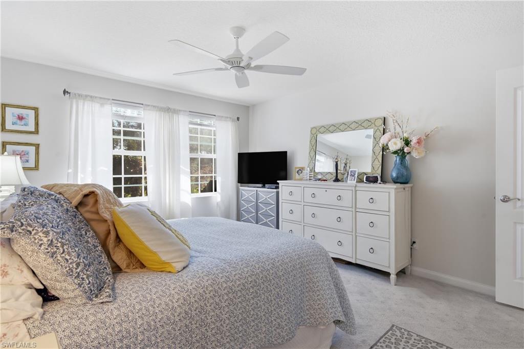3614 El Segundo Court Naples, FL 34109 - Photo 18 of 49 a bed room with a bed and a television