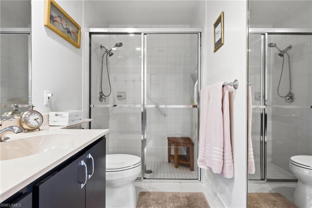3614 El Segundo Court Naples, FL 34109 - Photo 20 of 49 a bathroom with a sink toilet and shower