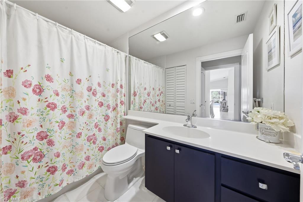 3614 El Segundo Court Naples, FL 34109 - Photo 22 of 49 a bathroom with a sink toilet and shower