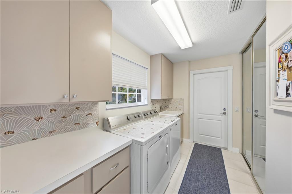 3614 El Segundo Court Naples, FL 34109 - Photo 23 of 49 a bathroom with a sink and a bathtub