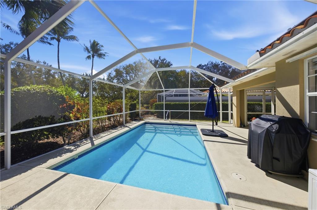 3614 El Segundo Court Naples, FL 34109 - Photo 25 of 49 a view of a balcony with door and wooden floors