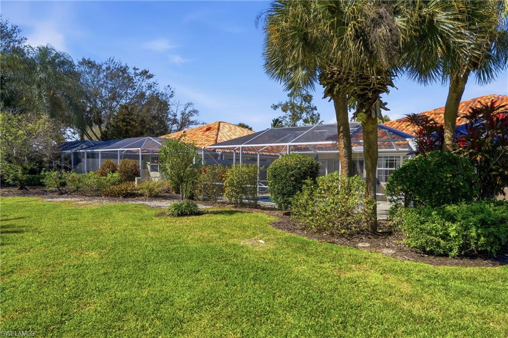 3614 El Segundo Court Naples, FL 34109 - Photo 28 of 49 a view of a house with a yard and sitting area