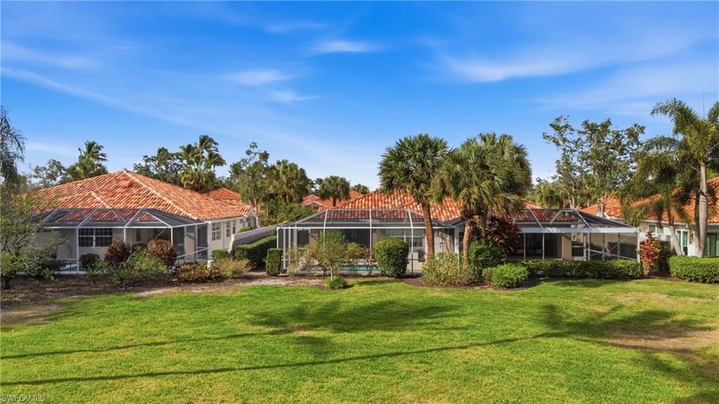 3614 El Segundo Court Naples, FL 34109 - Photo 29 of 49 a view of a house with a yard
