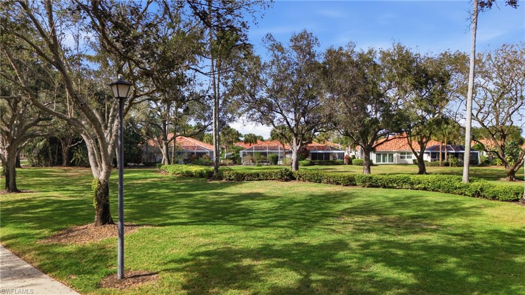3614 El Segundo Court Naples, FL 34109 - Photo 30 of 49 a view of a trees in front of a house
