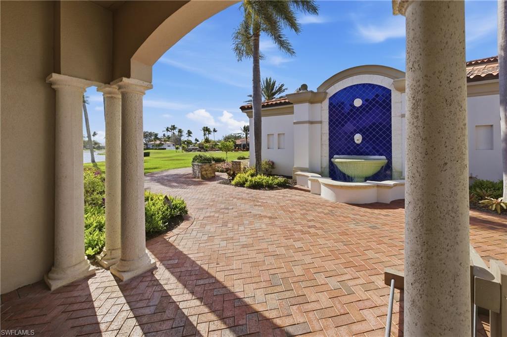 3614 El Segundo Court Naples, FL 34109 - Photo 32 of 49 a front view of a house with a yard