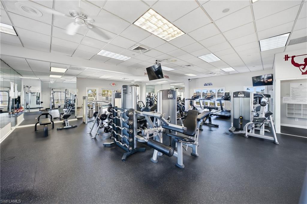 3614 El Segundo Court Naples, FL 34109 - Photo 40 of 49 a view of a room with lots of gym equipment