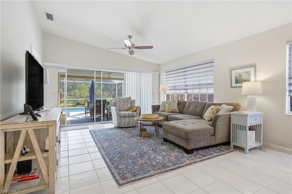 3614 El Segundo Court Naples, FL 34109 - Photo 4 of 49 a living room with furniture and a flat screen tv
