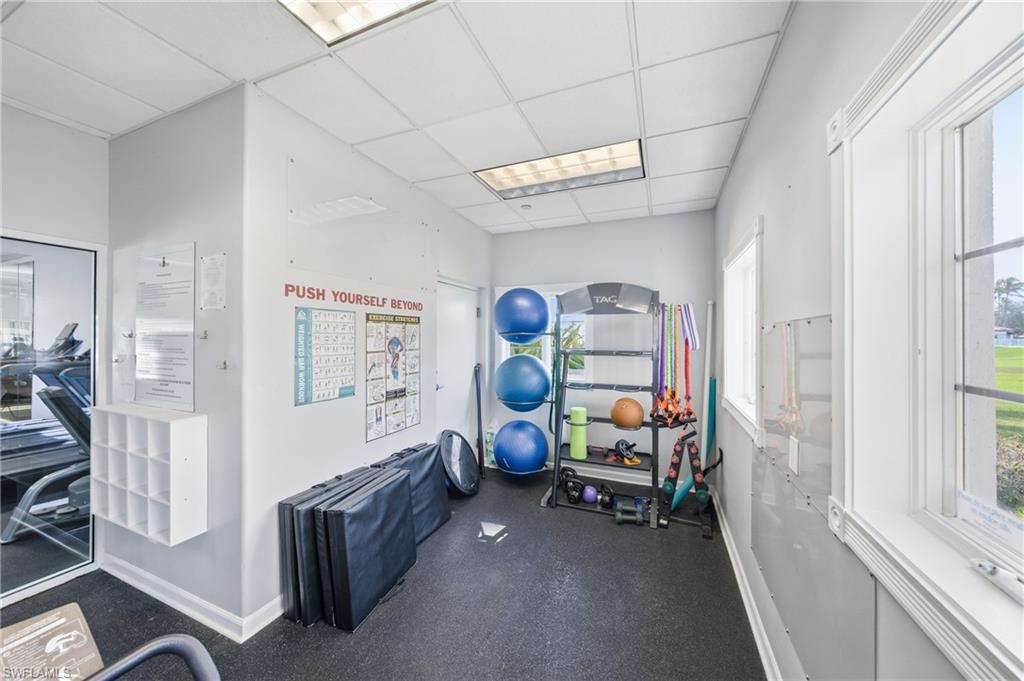 3614 El Segundo Court Naples, FL 34109 - Photo 41 of 49 a view of a room with gym equipment