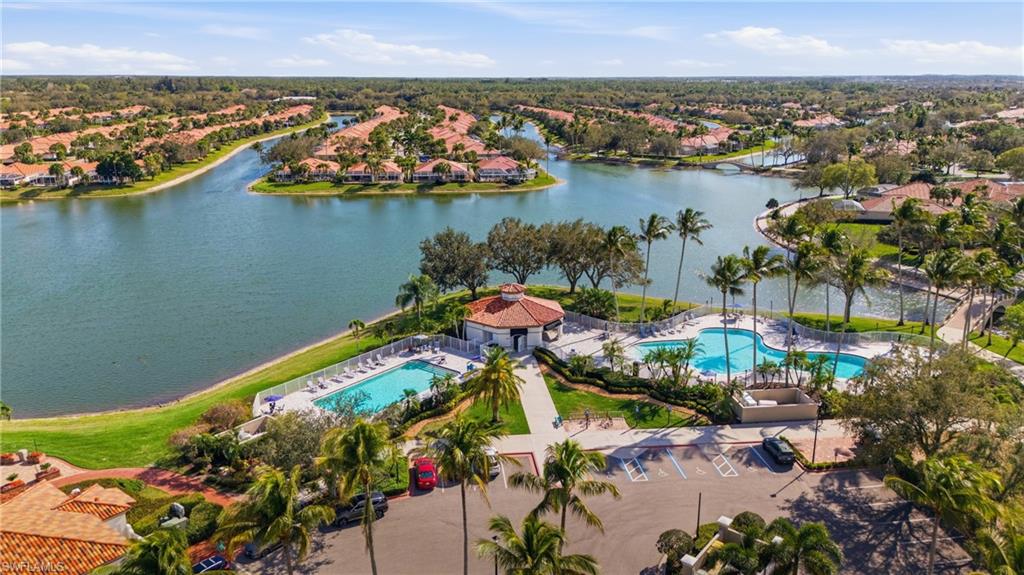 3614 El Segundo Court Naples, FL 34109 - Photo 47 of 49 an aerial view of a house with a lake view